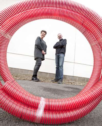 Mike and Kate and biomass pellet hose